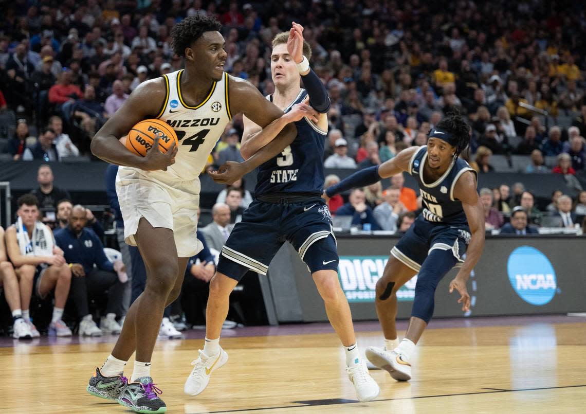 Utah State Aggies guard Steven Ashworth (3) fouls Missouri Tigers guard Kobe Brown (24) during a game for the NCAA Tournament at Golden 1 Center in Sacramento, Thursday, March 16, 2023.
