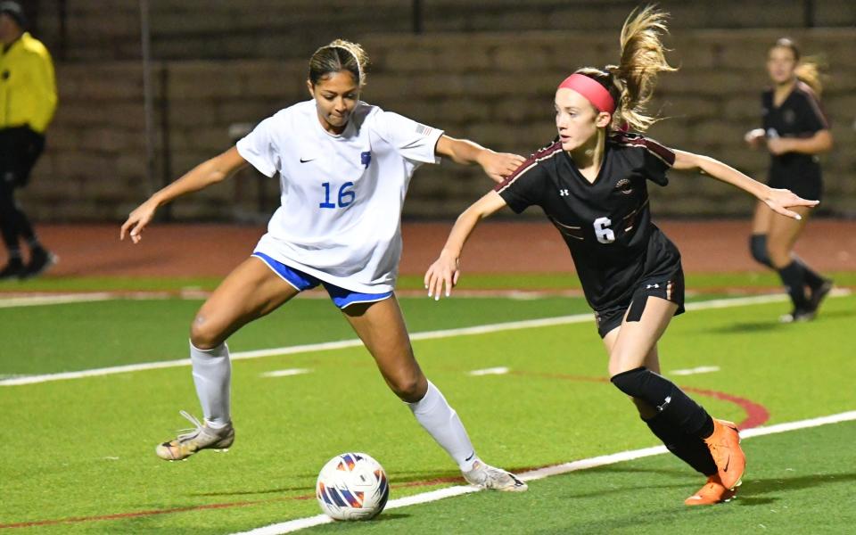 Oaks Christian's Avery Oder tries to get away a Santa Margarita player during the first match of the CIF-SS Open Division tournament at Oaks Christian School on Thursday, Feb. 8. The teams played to a 0-0 draw and will face off again Saturday at Santa Margarita.