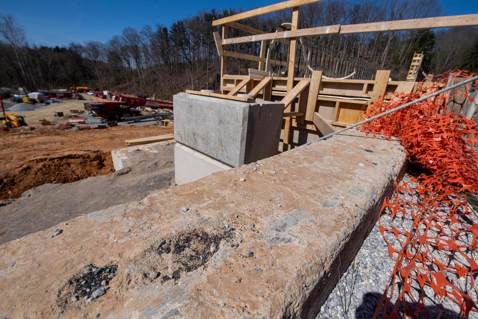 A boot print in the original core wall from a worker from over a century ago. The original core wall Is incorporated into the new new dam but won't be visible once construction is completed.