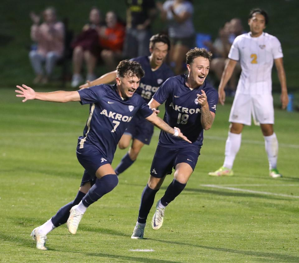 University of Akron's Josh Hallenberger, left, celebrates his second half goal against VCU with teammate Dyson Clapier on Monday, Aug. 29, 2022 in Akron, Ohio, at FirstEnergy Stadium.