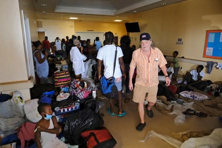 A man searches for his wife in the Marsh Harbour Medical Clinic in the aftermath of Hurricane Dorian on the Great Abaco island town of Marsh Harbour