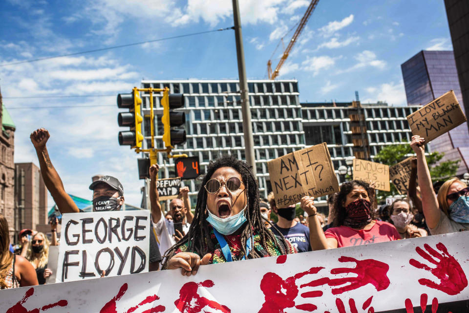 Image: Protesters march near the Minneapolis Police 1st Precinct on June 13, 2020. (Kerem Yucel / AFP - Getty Images)