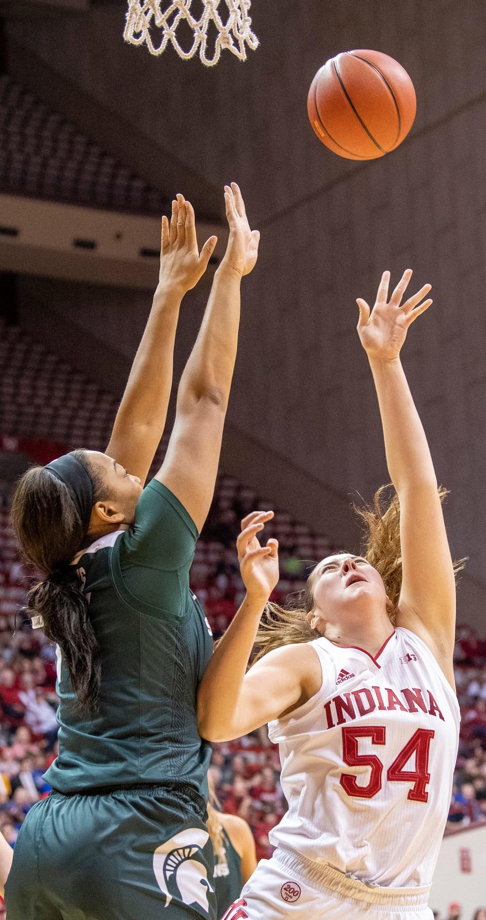 Indiana’s Mackenzie Holmes scores past Michigan State’s Mardrekia Cook during the Indiana versus Michigan State women’s basketball game at Simon Skjodt Assembly Hall Saturday, December 28, 2019.