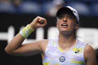 Iga Swiatek of Poland reacts after winning a point against Kaia Kanepi of Estonia during their quarterfinal match at the Australian Open tennis championships in Melbourne, Australia, Wednesday, Jan. 26, 2022. (AP Photo/Andy Brownbill)