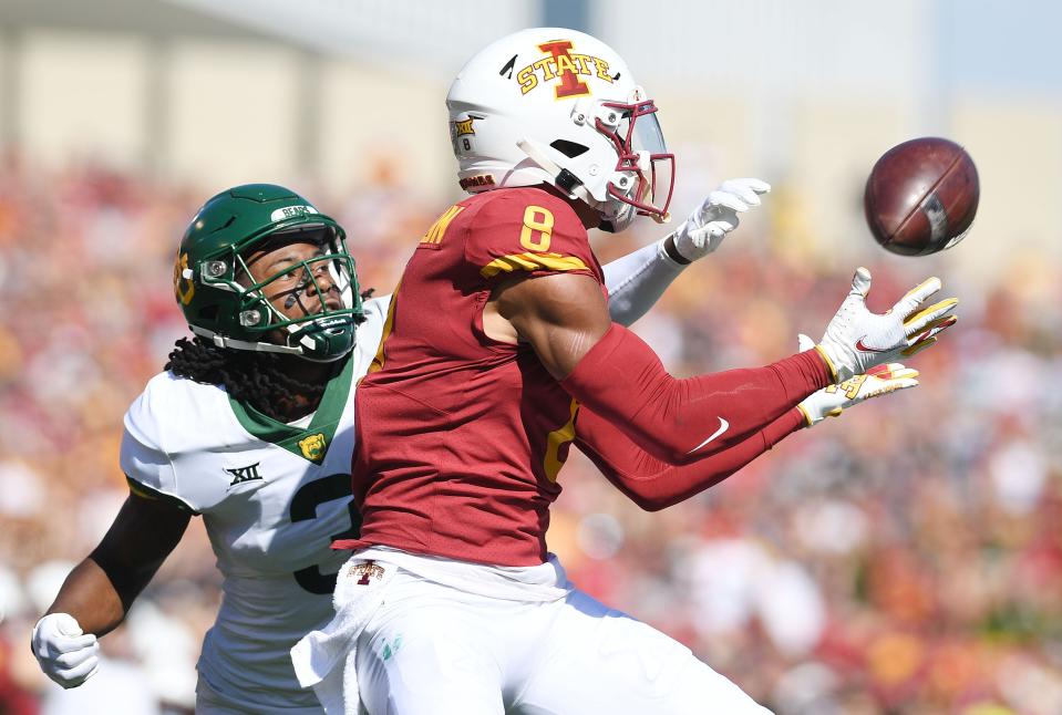 Iowa State wide receiver Xavier Hutchinson (8) makes a catch around Baylor's Mark Milton (3) during the first quarter at Jack Trice Stadium on Sept. 24.