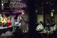 A bartender wearing face mask to protect against coronavirus makes a cocktail at Strelka bar in Moscow, Russia, Friday, Oct. 23, 2020. In much of Europe, city squares and streets, be they wide, elegant boulevards like in Paris or cobblestoned alleys in Rome, serve as animated evening extensions of drawing rooms and living rooms. As Coronavirus restrictions once again put limitations on how we live and socialize, AP photographers across Europe delivered a snapshot of how Friday evening, the gateway to the weekend, looks and feels. (AP Photo/Pavel Golovkin)