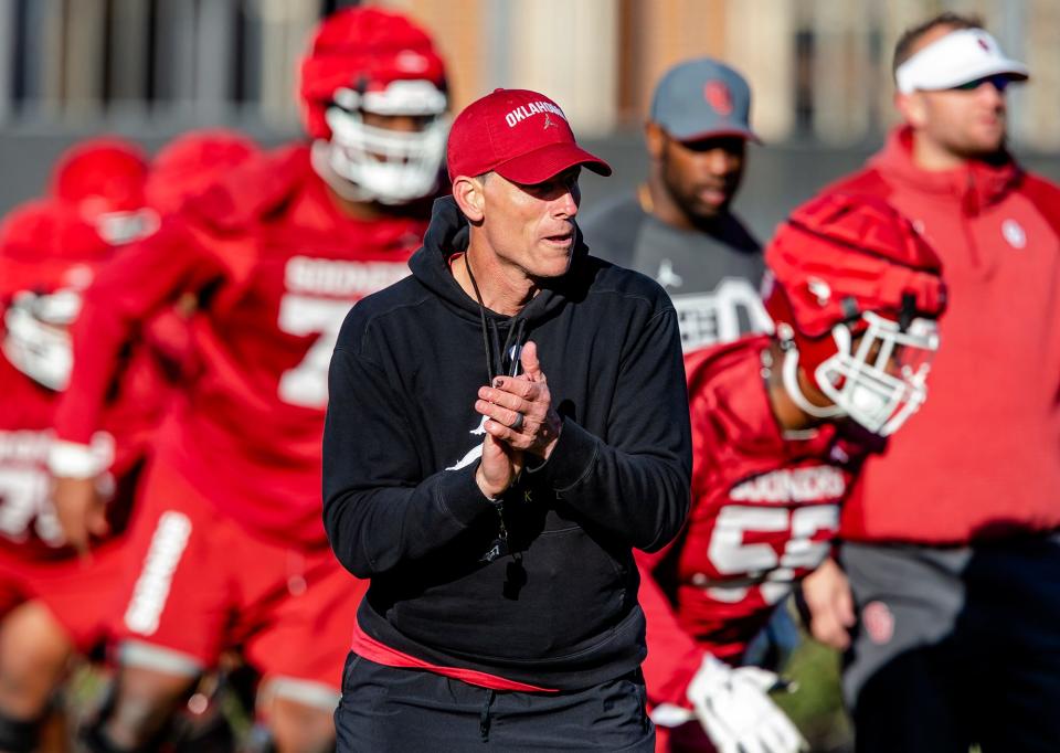 First-year OU football coach Brent Venables works with his team during Thursday’s practice in Norman.