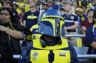 A Nashville SC fan wears a Boba Fett themed costume for Star Wars Night during an MLS soccer match between Nashville SC and CF Montréal, Saturday, May 4, 2024, in Nashville, Tenn. (AP Photo/George Walker IV)