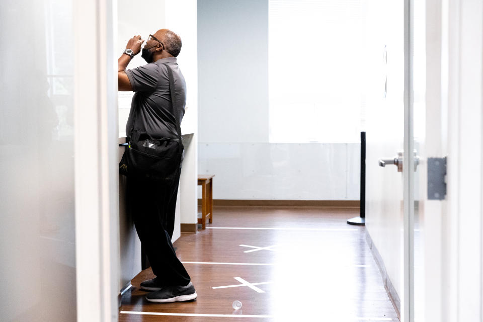 Harold Lewis, a recovering drug user, takes his dose of methadone on Monday, July 18, 2022 at Liberation Programs in Bridgeport, Conn. Liberation Programs is a behavioral health organization specializing in treatment for substance use disorders. (AP Photo/Julia Nikhinson)