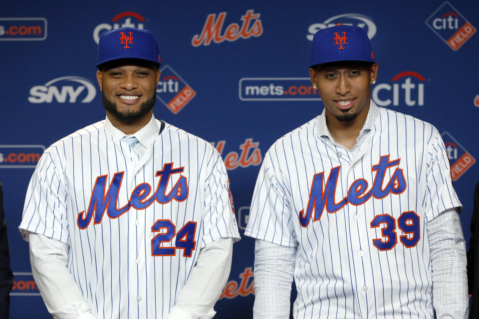 Robinson Cano, left, and Edwin Diaz pose for photos at a CitiField news conference, in New York, Tuesday, Dec. 4, 2018. (AP Photo/Richard Drew)