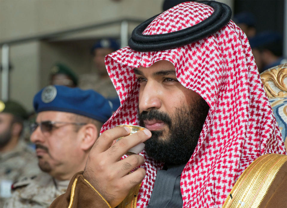 Saudi Arabia's Crown Prince Mohammed bin Salman drinks coffee during the graduation ceremony of the 93rd batch of the cadets of King Faisal Air Academy, in Riyadh