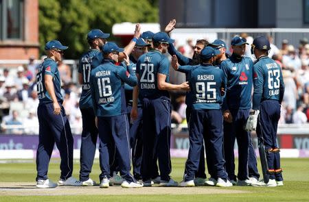 Cricket - England v Australia - Fifth One Day International - Emirates Old Trafford, Manchester, Britain - June 24, 2018 England's Moeen Ali celebrates with teammates after he takes the wicket of Australia's Marcus Stoinis Action Images via Reuters/Craig Brough