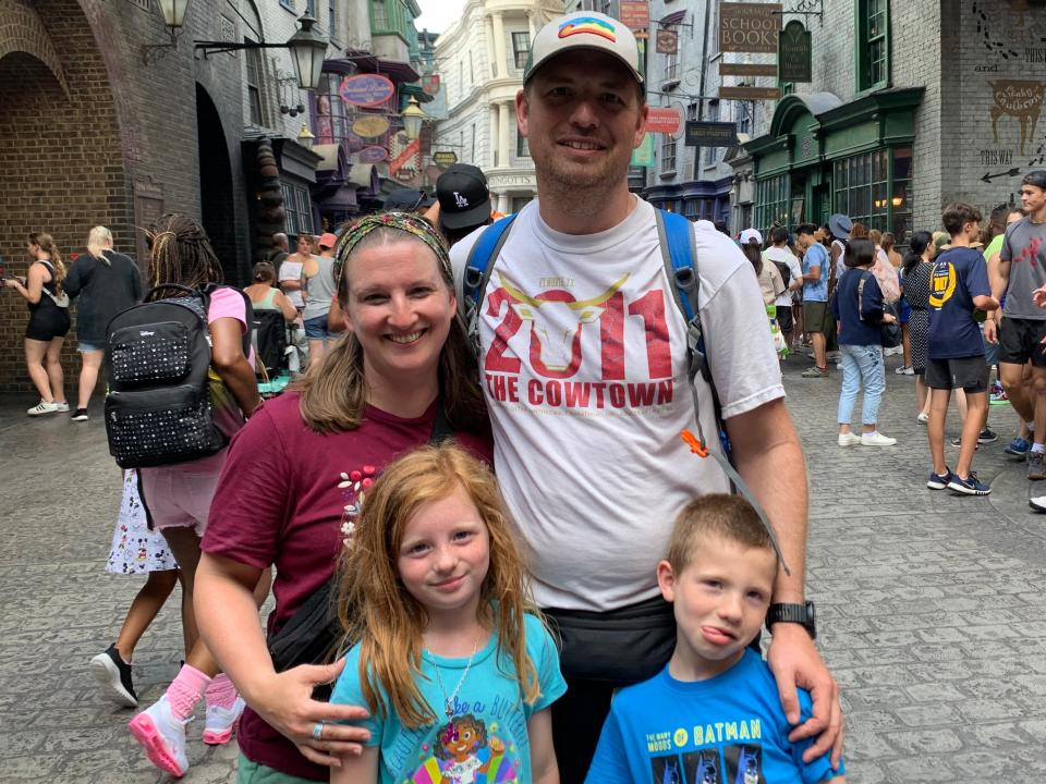 Author Mandy Bray, her husband, and two kids at Diagon Alley in Universal Studios