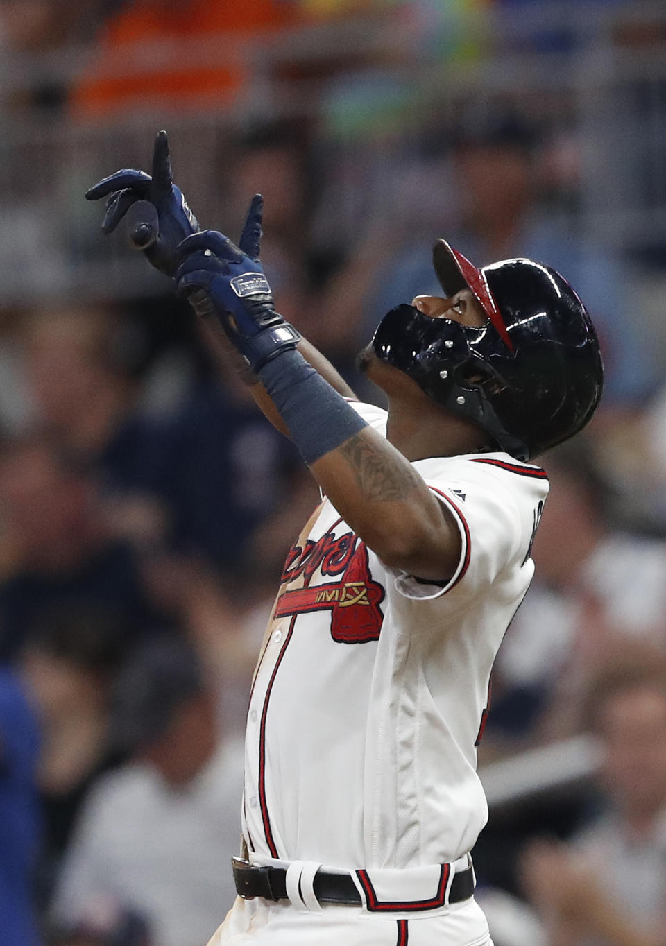 Atlanta Braves' Ronald Acuna Jr. (13) points skyward after driving in a run with a base hit in the sixth inning of the second baseball game of a doubleheader against the Miami Marlins Monday, Aug. 13, 2018 in Atlanta. (AP Photo/John Bazemore)