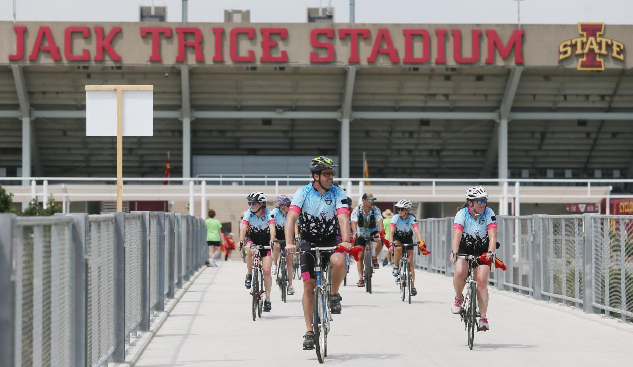 RAGBRAI riders enter the Jack Trice Stadium to finish the Day 3 of the ride.