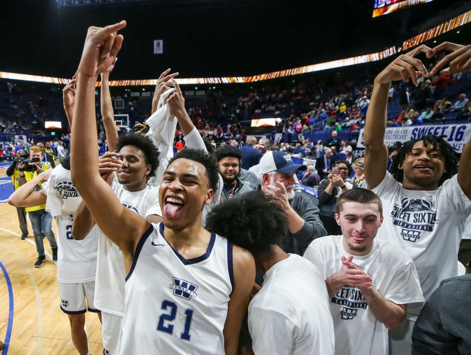 Warren Central guard Chappelle Whitney holds up his pinky as he and teammates celebrate after defeating George Rogers Clark and winning the 2023 Boys Sweet 16 Championship at Saturday's second KHSAA Boys Sweet 16 Final in Rupp Arena. Whitney was named Sweet 16 MVP. March 18, 2023 