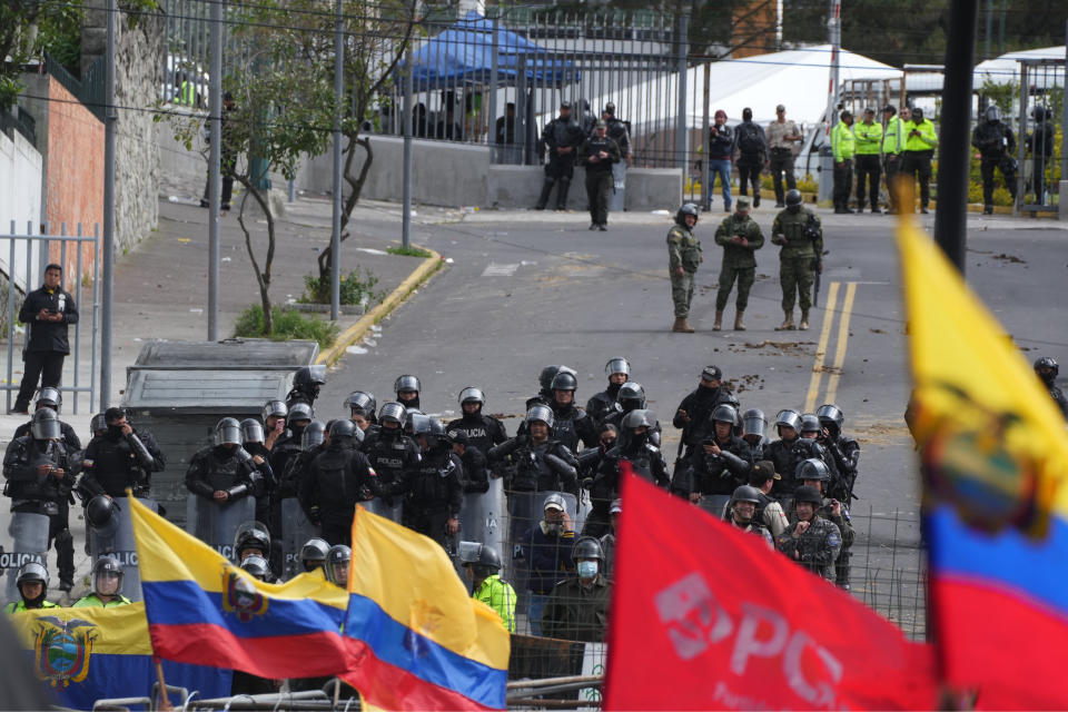 Riot police form a cordon as protesters rally to show their support for the recent protests and national strike against the government of President Guillermo Lasso, near the National Assembly, in Quito, Ecuador, Saturday, June 25, 2022. Ecuador’s president charged Friday that the Indigenous leader heading the nationwide strike is seeking to stage a coup and warned he will use all legal tools to contain the violence unleashed by the demonstrations. (AP Photo/Dolores Ochoa)