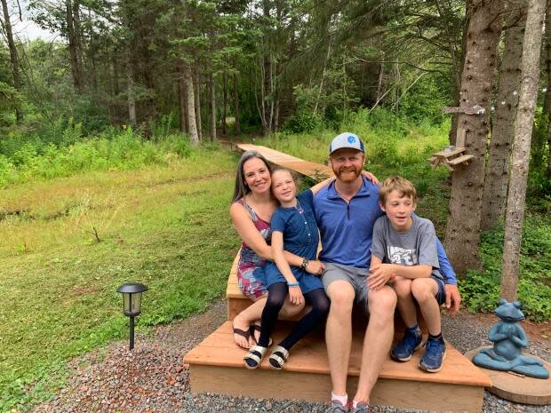 Heather and Jarrod Gunn McQuillan, with their children Finlay and Emma, say they love living in nature. (Shane Ross/CBC - image credit)