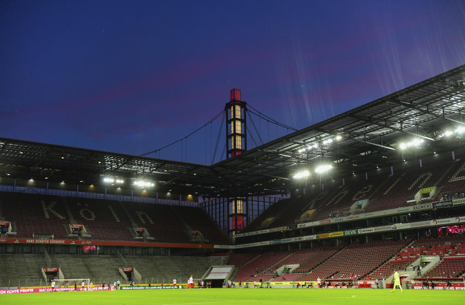 The stands are empty during the German Bundesliga soccer match between 1. FC Cologne and RB Leipzig, in Cologne, Germany, Monday, June 1, 2020. Because of the coronavirus outbreak all soccer matches of the German Bundesliga take place without spectators. (Ina Fassbender/Pool via AP)