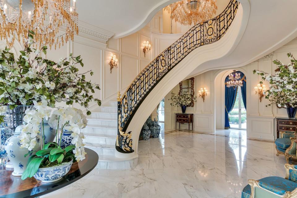 <p>The staircase's cast-iron and gold-leaf banister, meanwhile, was <a rel="nofollow noopener" href="https://www.wsj.com/articles/my-very-own-versailles-homeowners-who-recreate-the-french-palace-1499349435" target="_blank" data-ylk="slk:modeled on one at Marie Antoinette's Le Petit Trianon;elm:context_link;itc:0;sec:content-canvas" class="link ">modeled on one at Marie Antoinette's Le Petit Trianon</a>. </p>