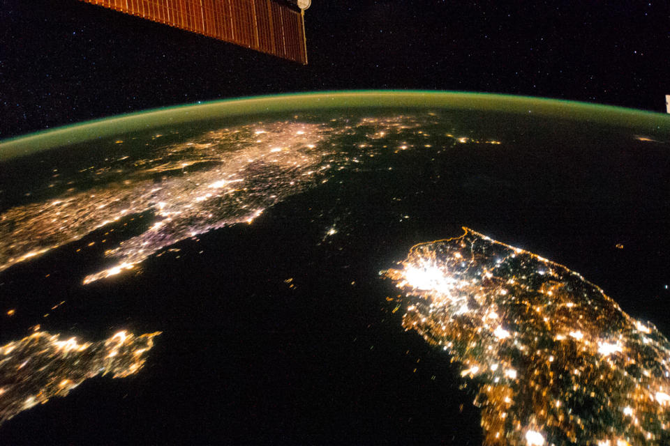 This Jan. 30, 2014 photo made available by NASA on Monday, Feb. 24, 2014 shows North Korea, darker area at center, between South Korea, right, and China, left. Lights from the North Korean capital, Pyongyang, are visible at center. The image comparing the night time lights of the countries was made by the Expedition 38 crew aboard the International Space Station. (AP Photo/NASA)