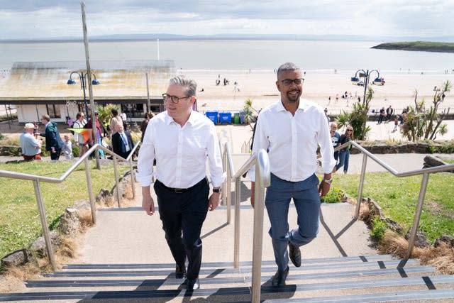 Sir Keir Starmer and First Minister of Wales Vaughan Gething walking up some steps on Barry seafront