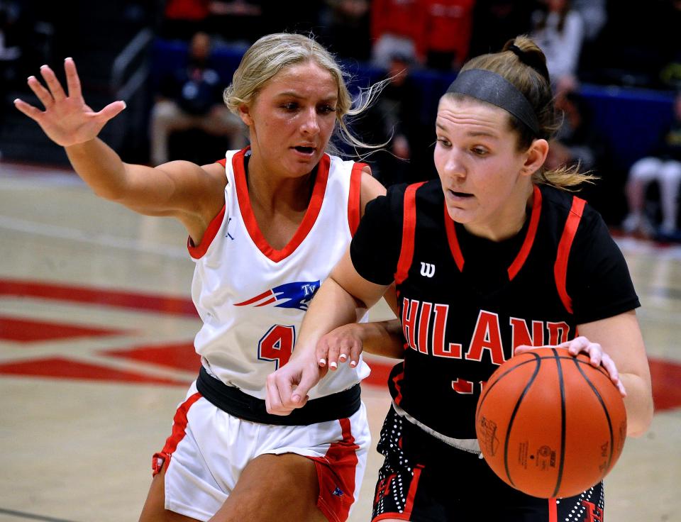 Tri-Village's Rylee Sagester applies pressure defense on Hiland's Mallory Stutzman