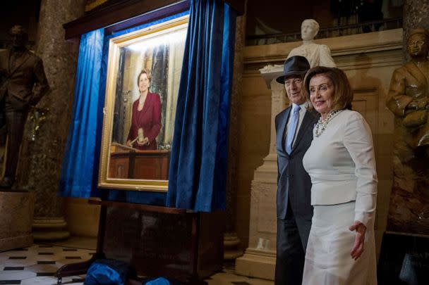 PHOTO: House Speaker Nancy Pelosi (D-CA) stands with her husband Paul as a portrait of her is unveiled at Statuary Hall in the U.S. Capitol, U.S., Dec. 14, 2022. (Mary F. Calvert/Reuters)