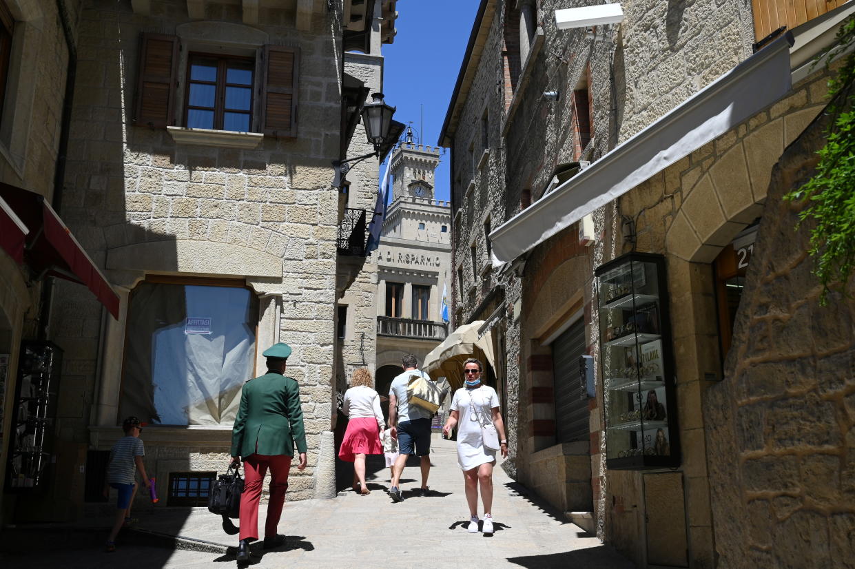 People walk, as the Republic of San Marino starts a campaign inviting tourists to get vaccinated with the Russia's Sputnik V COVID-19 vaccine, June 1, 2021. Picture taken June 1, 2021. REUTERS/Alberto Lingria