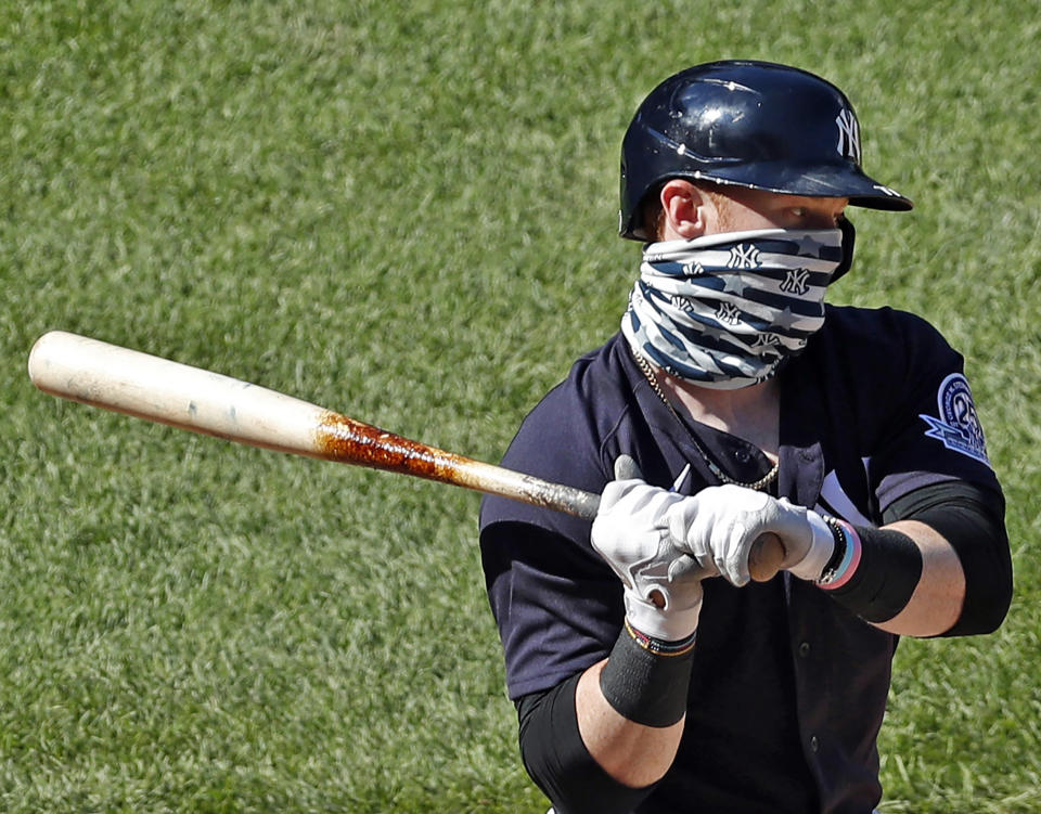 Clint Frazier wears a face mask while batting during an intrasquad game.