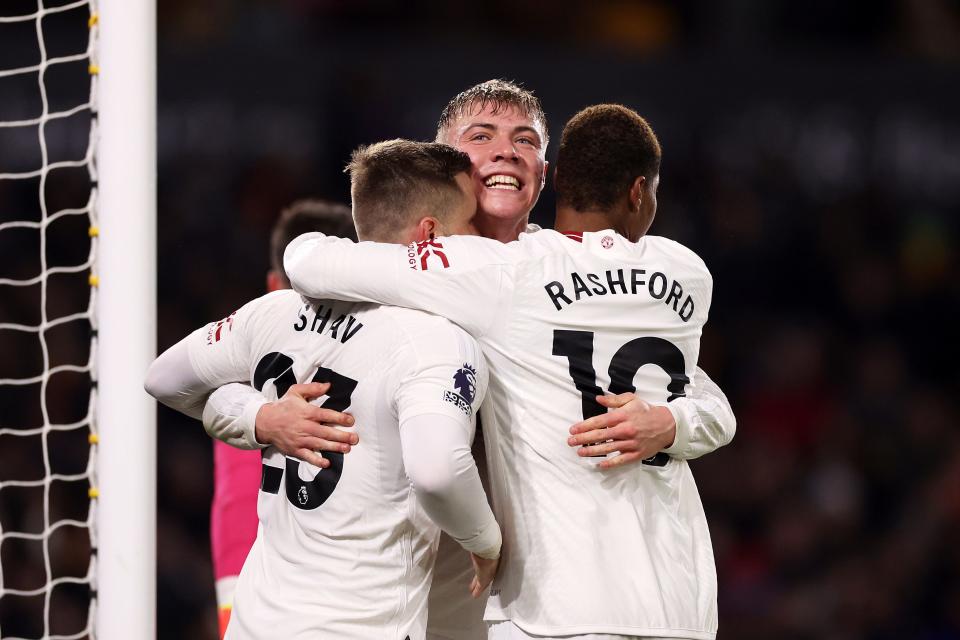 Rasmus Hojlund of Manchester United celebrates with Luke Shaw and Marcus Rashford.