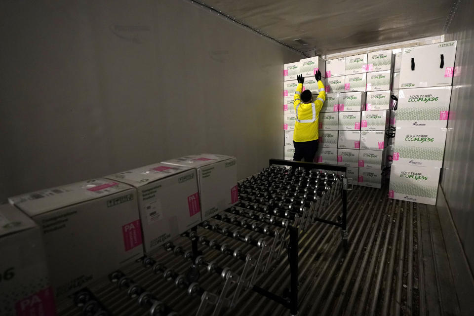 FILE - Boxes containing the Moderna COVID-19 vaccine are loaded into a truck for shipping at the McKesson distribution center in Olive Branch, Miss., Dec. 20, 2020. The nation’s COVID-19 death toll stands at around 800,000 as the anniversary of the U.S. vaccine rollout arrives. A year ago it stood at 300,000. What might have been a time to celebrate a scientific achievement is fraught with discord and mourning. (AP Photo/Paul Sancya, Pool, File)