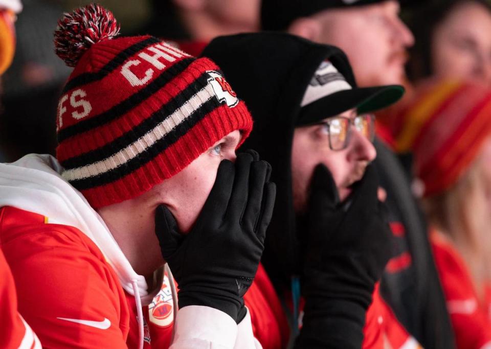 Blake Ireland reacts after a Kansas City fumble during the first half while watching the game from the Power and Light District in downtown Kansas City.