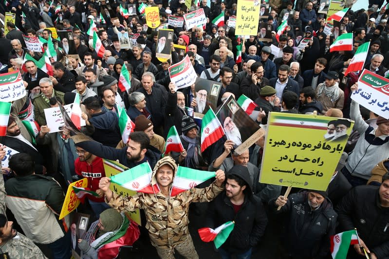 Iranian pro-government protesters attend a demonstration in Tehran