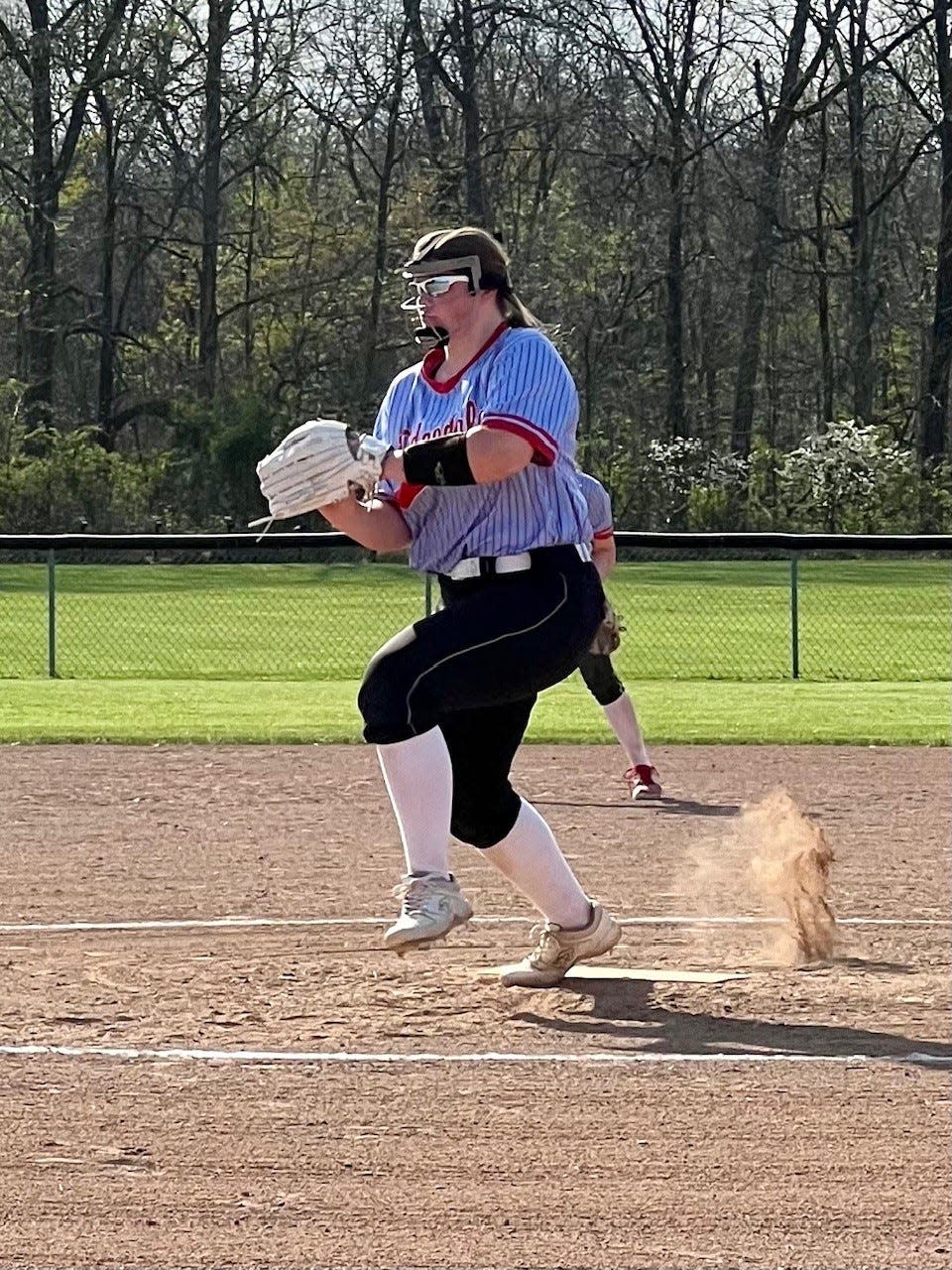 Ridgedale's Kenzie Delaney delivers a pitch to a North Baltimore batter during a Northwest Central Conference softball game earlier this season at home.