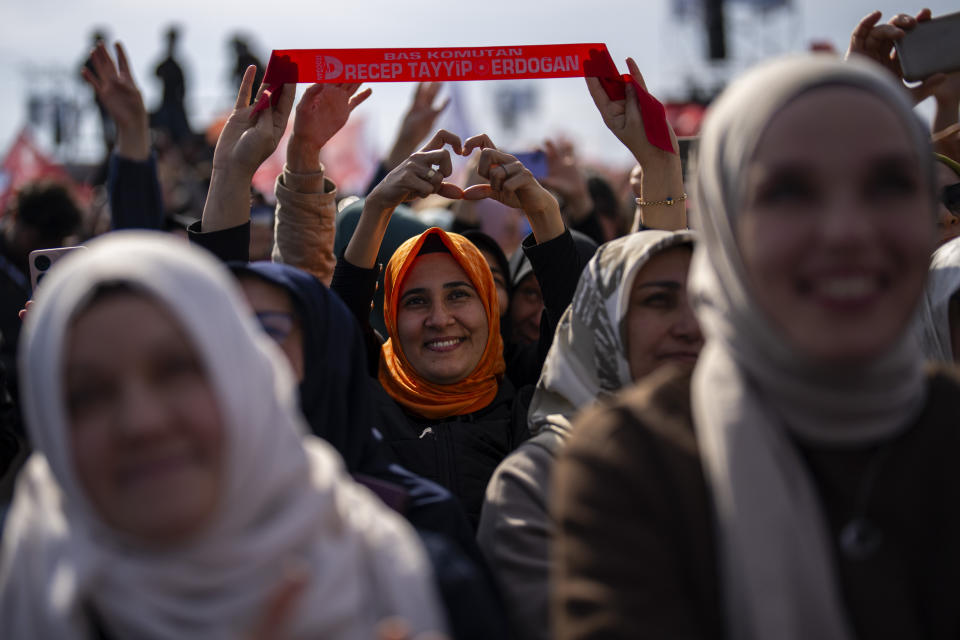 Justice and Development Party, or AKP, supporters listen to Turkish President and party leader Recep Tayyip Erdogan during a campaign rally ahead of nationwide municipality elections, in Istanbul, Turkey, Sunday, March 24, 2024. With local elections across Turkey days away, legal experts are coaching thousands of volunteer election monitors on the rules they'll need to watch for fraud and ensure a fair vote. (AP Photo/Francisco Seco)