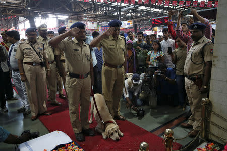 Policemen pay their respects at a memorial to mark the tenth anniversary of the November 26, 2008 attacks, at a railway station in Mumbai, India, November 26, 2018. REUTERS/Francis Mascarenhas