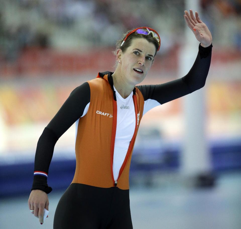 Irene Wust of the Netherlands waves to the crowd after the women's 3000-meter speedskating competition at the 2014 Winter Olympics, Sunday, Feb. 9, 2014, in Sochi, Russia. Wust went on to win the gold medal. (AP Photo/Morry Gash)