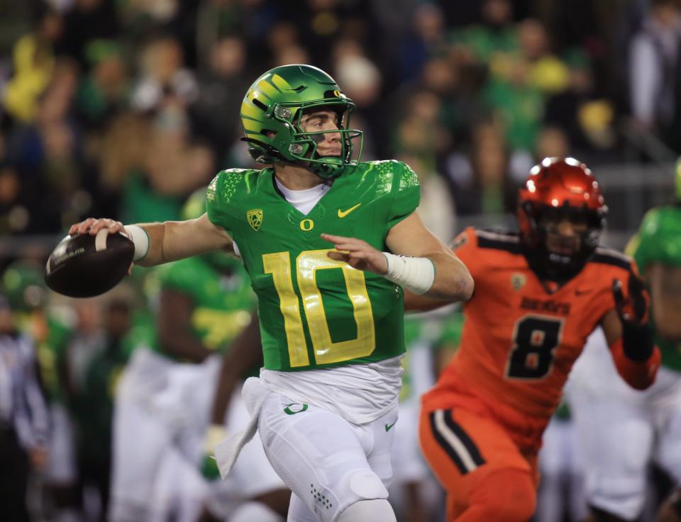Oregon quarterback <a class="link " href="https://sports.yahoo.com/ncaaf/players/299270/" data-i13n="sec:content-canvas;subsec:anchor_text;elm:context_link" data-ylk="slk:Bo Nix;sec:content-canvas;subsec:anchor_text;elm:context_link;itc:0">Bo Nix</a> throws down field against Oregon State during the second quarter at Autzen Stadium Friday, Nov. 24, 2023 in Eugene. © Chris Pietsch/The Register-Guard / USA TODAY NETWORK