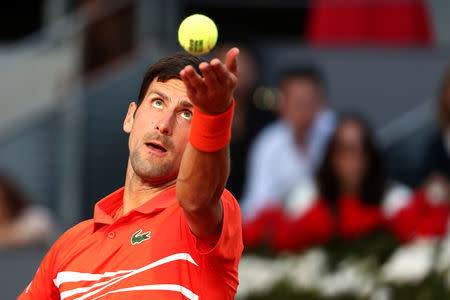 FILE PHOTO: Tennis - ATP 1000 - Madrid Open - The Caja Magica, Madrid, Spain - May 12, 2019 Serbia's Novak Djokovic in action during the final against Greece's Stefanos Tsitsipas REUTERS/Sergio Perez