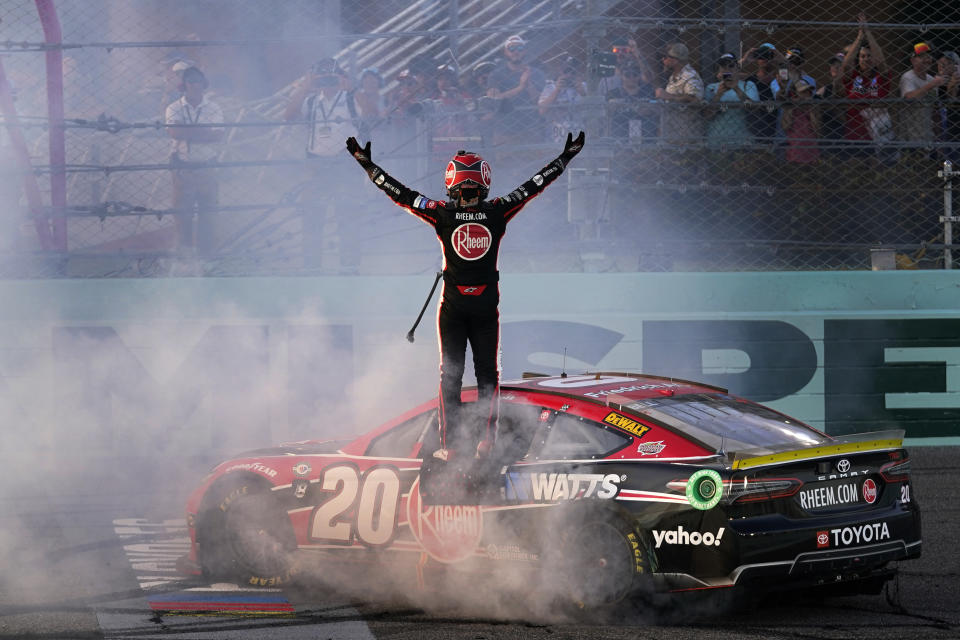 Christopher Bell celebrates after winning the NASCAR Cup Series auto race at Homestead-Miami Speedway, Sunday, Oct. 22, 2023, in Homestead, Fla. (AP Photo/Wilfredo Lee)