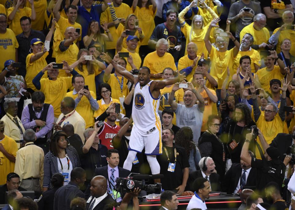<p>Golden State Warriors forward Andre Iguodala (9) celebrates with fans in the stands after defeating the Cleveland Cavaliers in game five of the 2017 NBA Finals at Oracle Arena. Mandatory Credit: Kyle Terada-USA TODAY Sports </p>