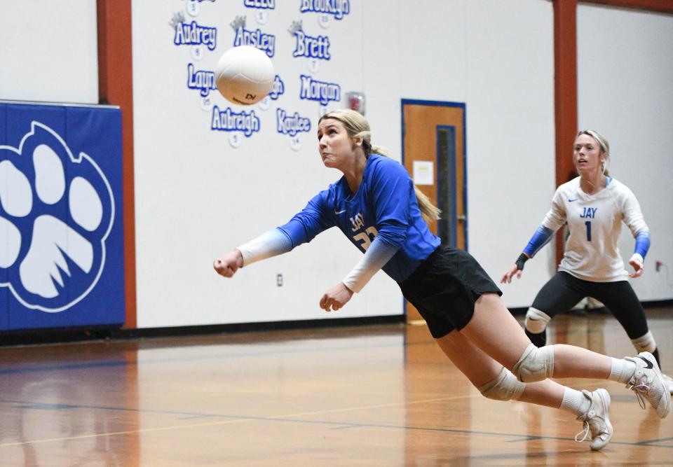 Brooklyn Sorrells (23) dives for the ball during the Baker vs Jay 1-1A District Tournament championship volleyball match at Jay High School on Thursday, Oct. 19, 2023.