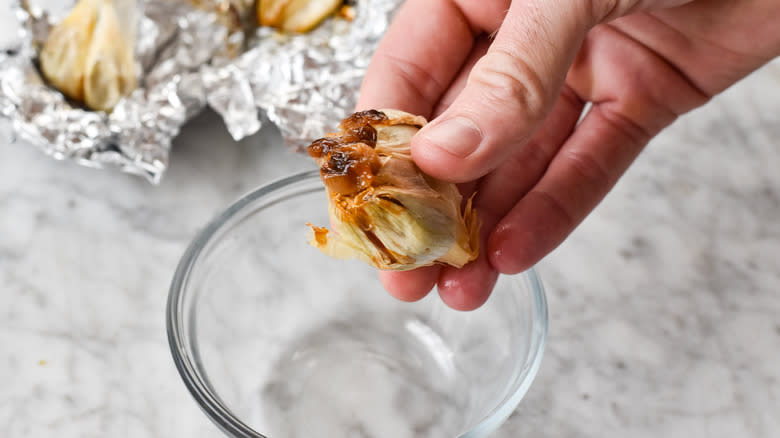 squeezing roasted garlic cloves