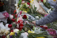 <p>Flowers are placed at a memorial for victims of the mass killing on Yonge Street at Finch Avenue on April 24, 2018 in Toronto, Canada. (Photo: Cole Burston/Getty Images) </p>