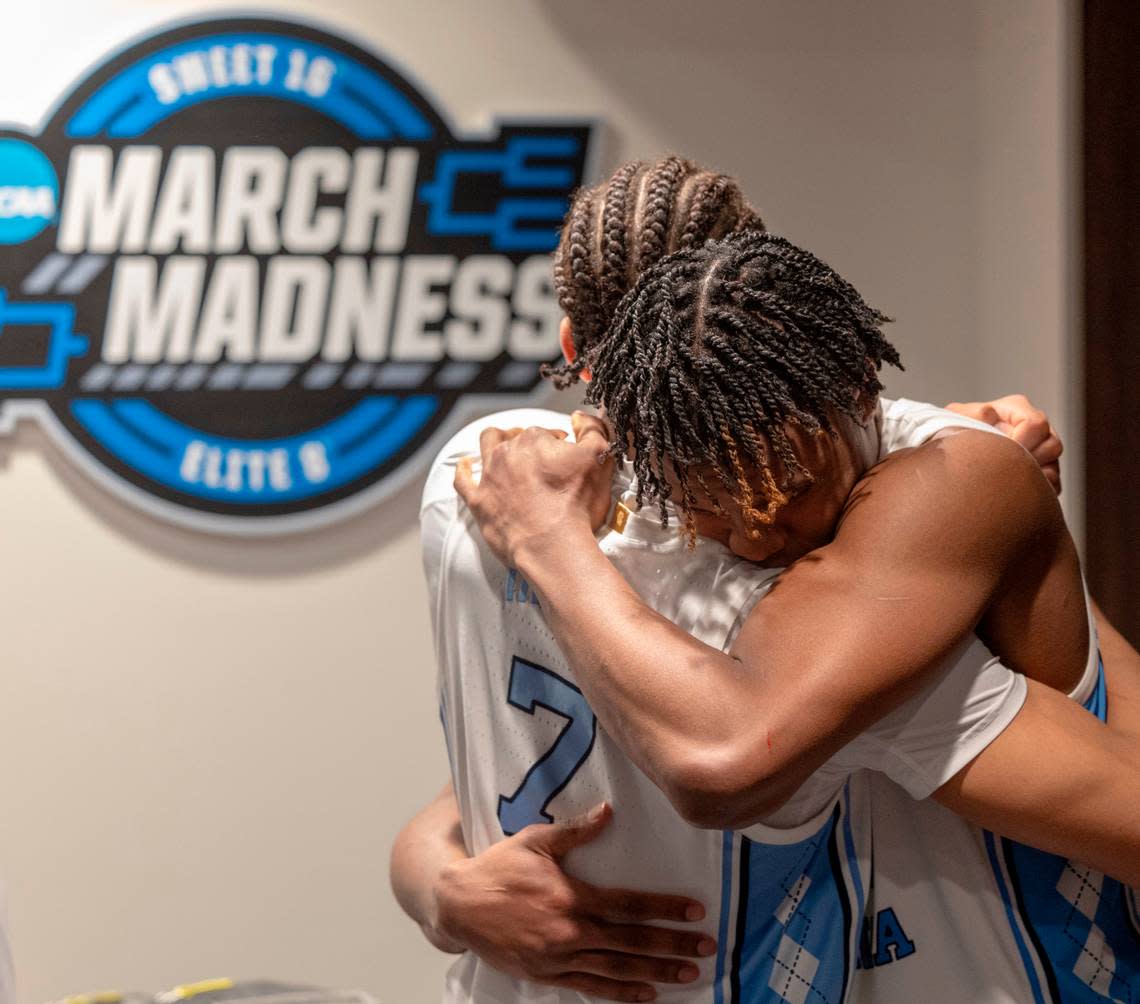 North Carolina’s Seth Trimble (7) embraces teammate Harrison Ingram (55) inside the Tar Heels’ locker room following their 89-87 loss to Alabama in the West Regional Sweet Sixteen on Thursday, March 28, 2024 at Crypto.com Arena in Los Angeles, CA.