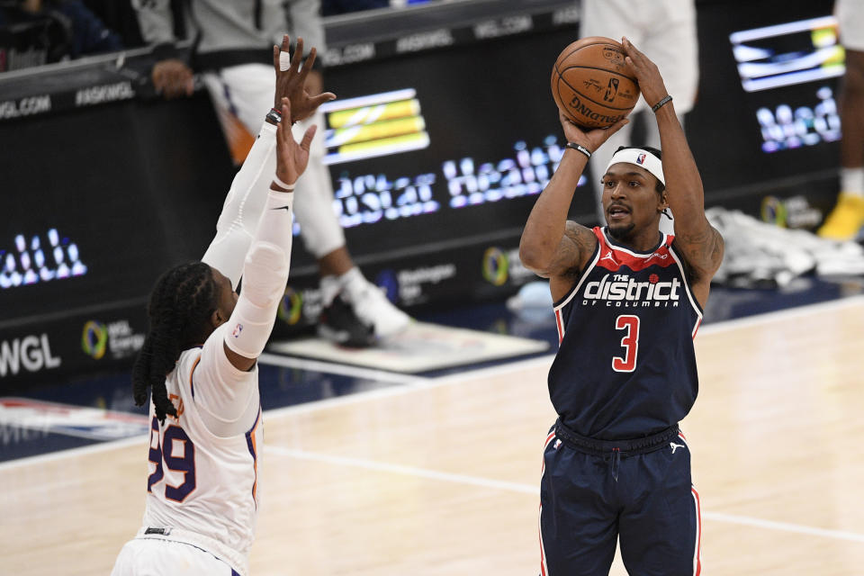 Washington Wizards guard Bradley Beal (3) shoots against Phoenix Suns forward Jae Crowder (99) during the second half of an NBA basketball game, Monday, Jan. 11, 2021, in Washington. (AP Photo/Nick Wass)