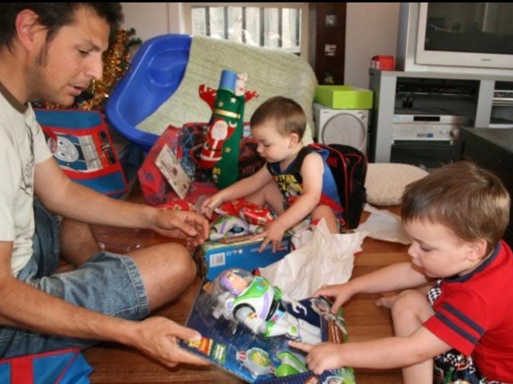 Ash Jurberg and his twins celebrating Christmas.