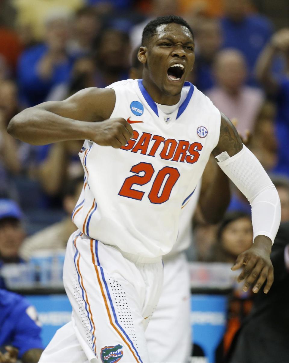 Florida guard Michael Frazier II (20) celebrates a goal against UCLA during the second half in a regional semifinal game at the NCAA college basketball tournament, Thursday, March 27, 2014, in Memphis, Tenn. (AP Photo/John Bazemore)