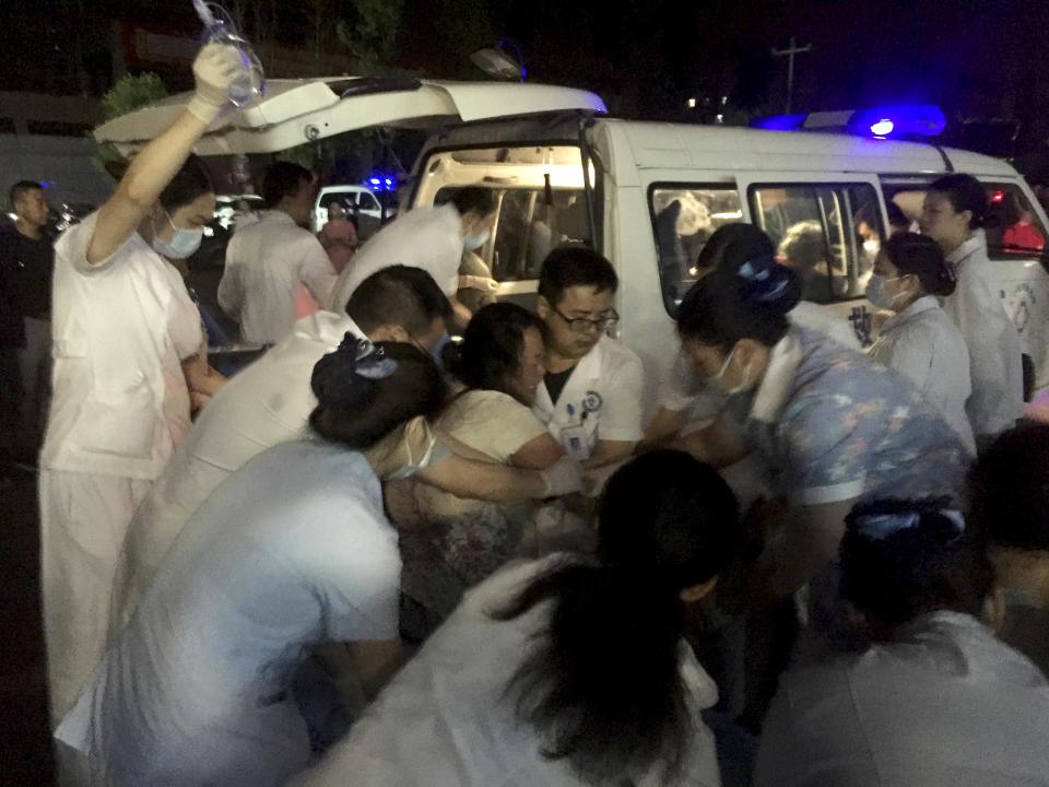 In this photo released by Xinhua News Agency, medical staff tend to a wounded at a local hospital in the aftermath of an earthquake in Changning County of Yibin City, southwest China's Sichuan Province, early Tuesday, June 18, 2019. The strong earthquake that hit Sichuan province in southern China late Monday night killed and injured some, officials and news reports said. (Wan Min/Xinhua via AP)